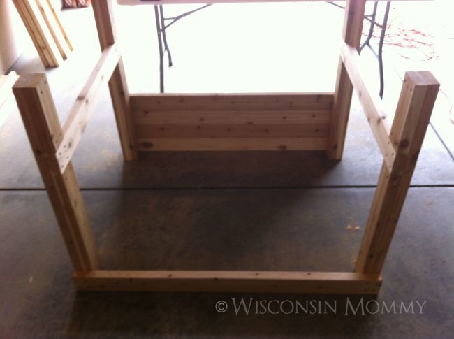 elevated garden bed with one wall completed