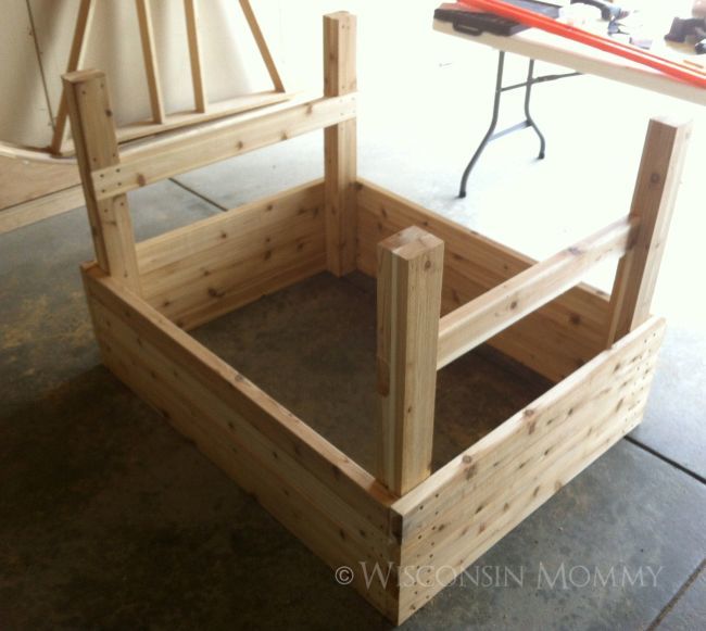 wood elevated garden bed with four walls completed