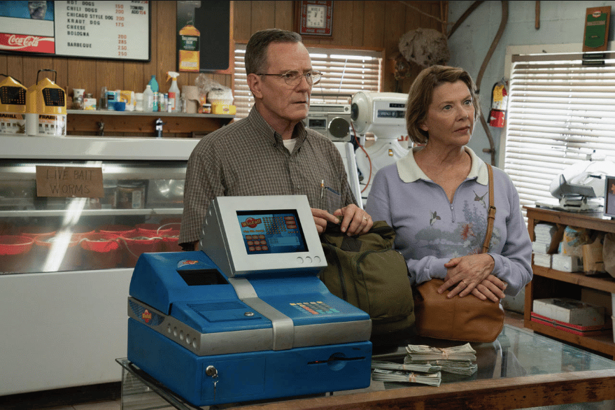Man and woman standing in front of cash register