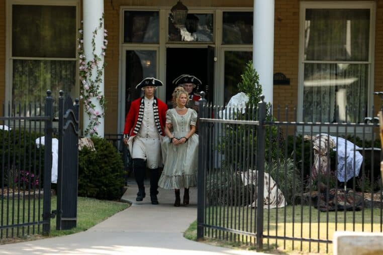 revolutionary era woman being arrested by two redcoats