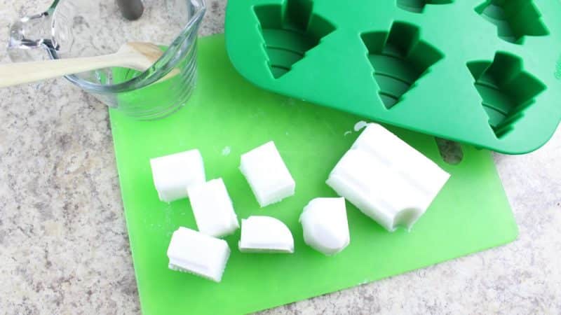 small glycerin soap cubes on a green cutting board