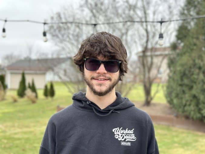 young man outside in sunglasses