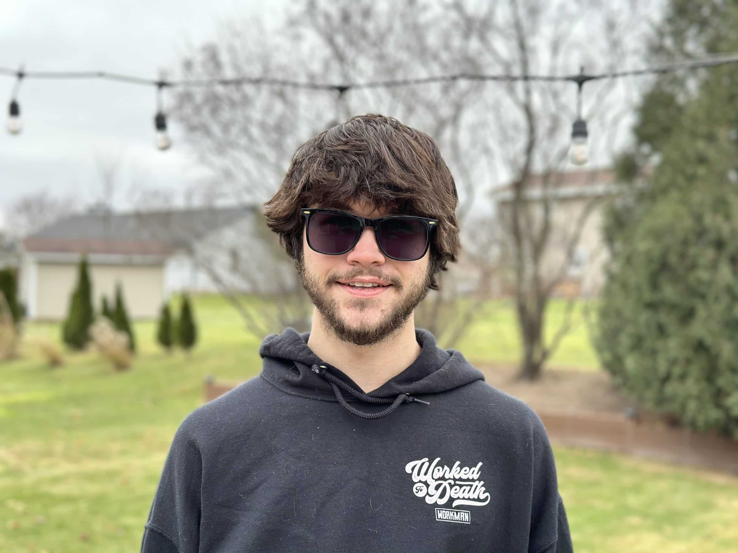 young man outside in sunglasses